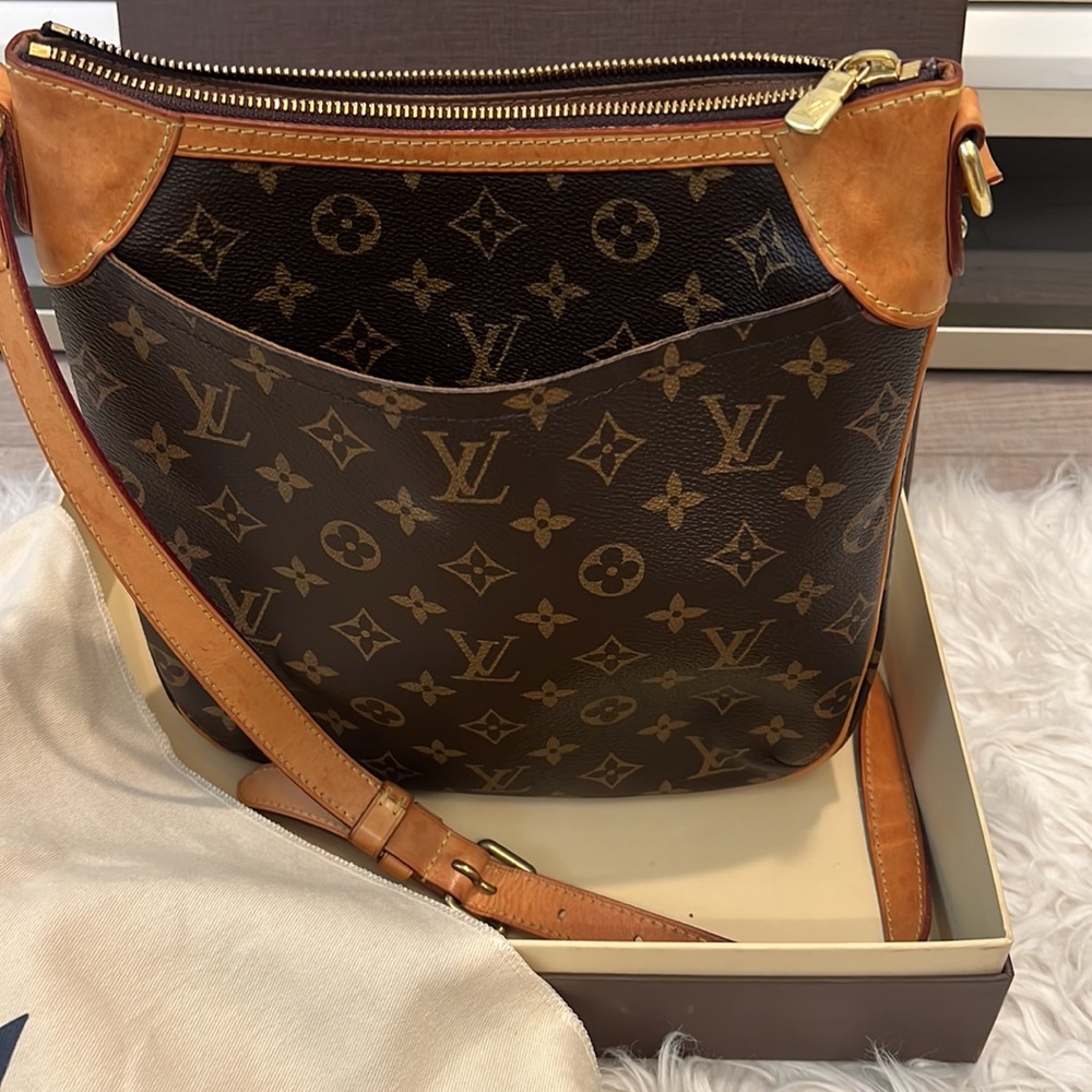 Louis Vuitton - Crossbody you will love! Deep pockets & zipper for safe travel!